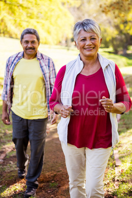 Happy mature couple at park Happy mature couple at park