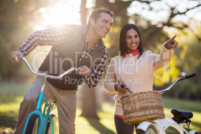 Couple with bicycles at park