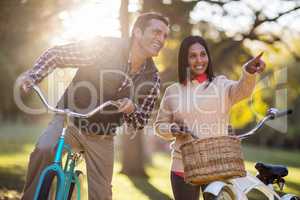 Couple with bicycles at park