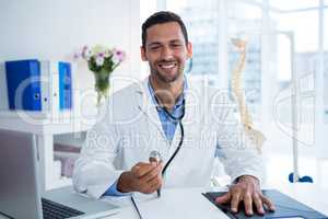 Portrait of physiotherapist holding stethoscope