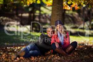 Side view of couple hugging at park