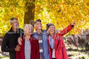 Happy family looking away at park