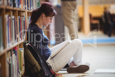 Mature student reading a book