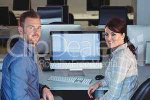 Mature students sitting at desk