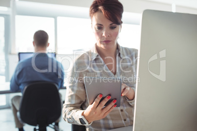 Mature student using digital tablet Mature student using digital tablet