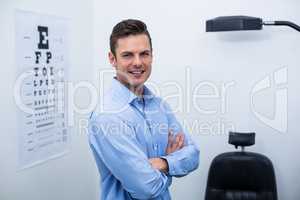 Optometrist standing in ophthalmology clinic