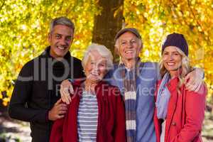 Portrait of happy family standing at park