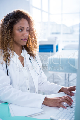 Physiotherapist working on computer Physiotherapist working on computer