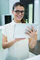 Female customer using digital tablet