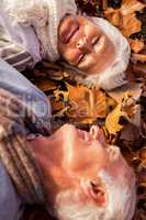 Senior couple lying on the ground
