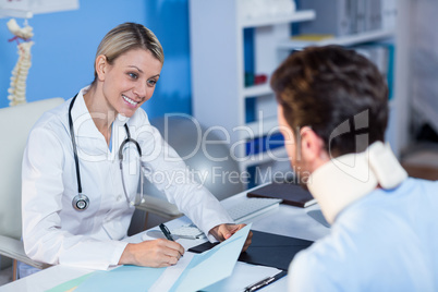 Physiotherapist interacting with patient