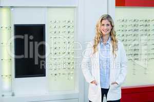 Beautiful optometrist standing in ophthalmology clinic