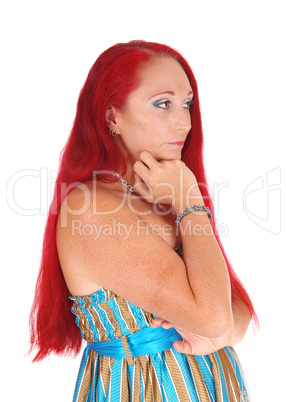 Portrait of woman with long red hair.