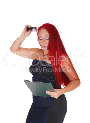 Woman with clipboard and glasses.