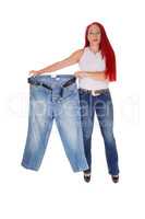 Woman holding big pants.