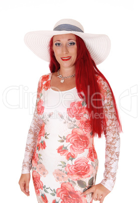 Gorgeous woman in dress and hat.