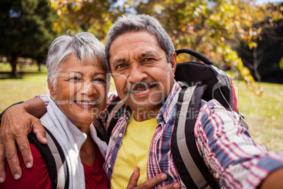 An elderly couple posing for a selfie