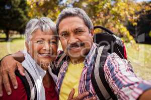 An elderly couple posing for a selfie