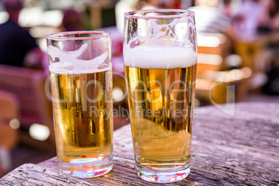 Beer glasses with beer on the table in the beer garden