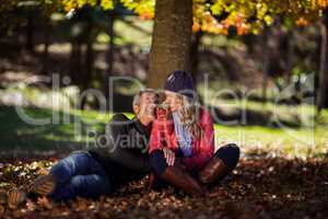 Side view of couple hugging at park