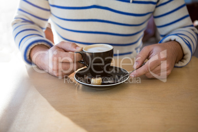 Man holding a coffee cup