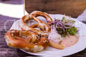 Pretzel with cream cheese on the plate