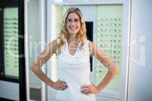 Beautiful customer standing in optical store