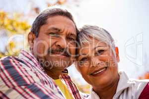 Portrait of elderly couple embracing