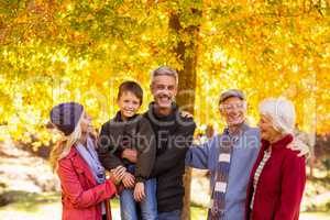 Happy family at park during autumn