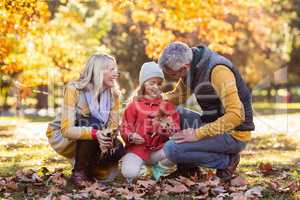 Happy family at park during autumn