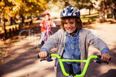 Portrait of smiling boy riding bicycle