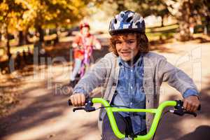 Portrait of smiling boy riding bicycle