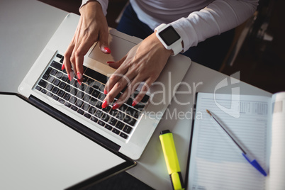 Close-up of student using laptop