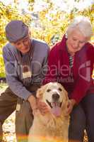 Elderly couple with their pet dog