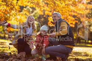 Joyful family at park during autumn