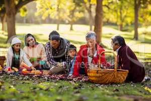 Happy family relaxing at park