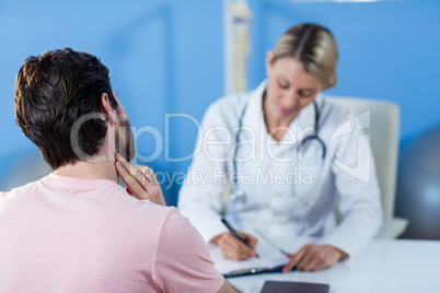 Physiotherapist interacting with patient