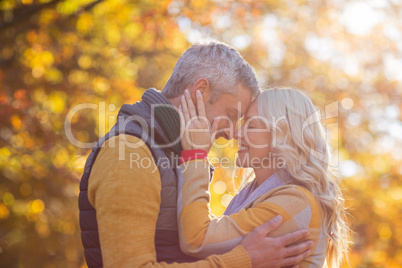 Side view of romantic couple at park