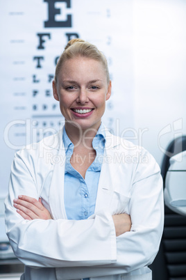 Female optometrist smiling in ophthalmology clinic