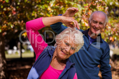 Elderly couple making fitness