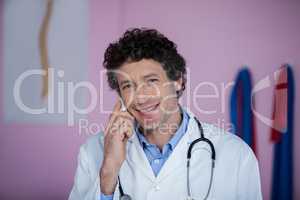 Portrait of physiotherapist talking on mobile phone