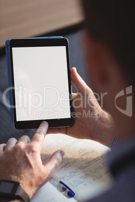 Mature student using digital tablet