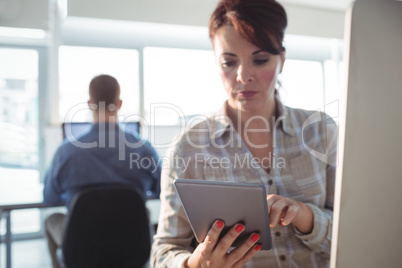 Mature student using digital tablet