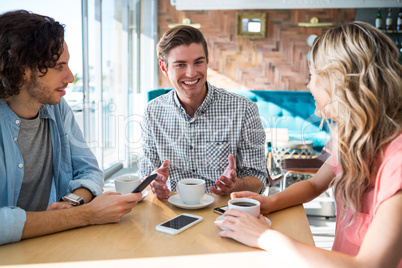 Friends talking in the coffee shop