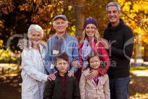 Portrait of multi-generation family standing at park