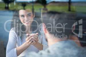 Couple having coffee in coffee shop