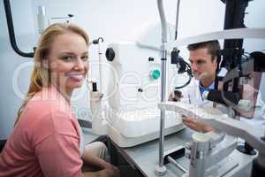 Female patient smiling in ophthalmology clinic