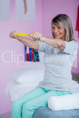 Senior woman exercising with exercise band