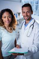 Portrait of physiotherapist and female patient in clinic