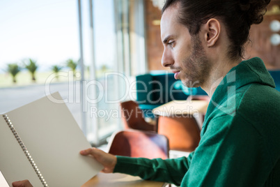 Man looking at menu